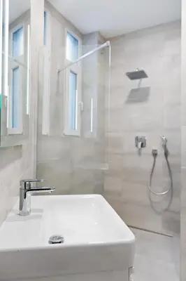 a bathroom with a sink and a shower at Cozy & Spacious Apartment for 5 Guests in Prague in Prague