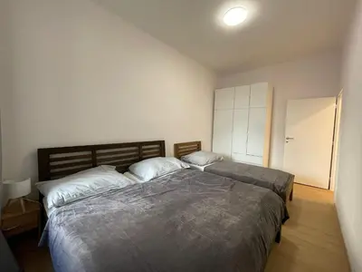 a bedroom with two beds in a room at Cozy & Spacious Apartment for 5 Guests in Prague in Prague