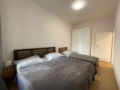 a bedroom with two beds in a room at Cozy & Spacious Apartment for 5 Guests in Prague in Prague