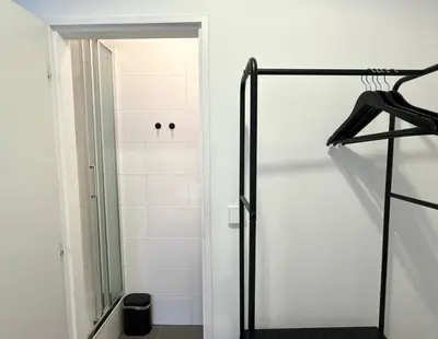 a shower with a glass door in a bathroom at MiSTO 16 in Prague