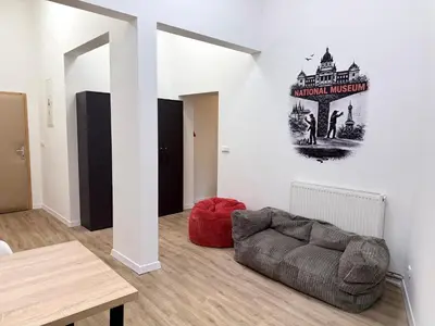a living room with a couch and a table at MiSTO 16 in Prague