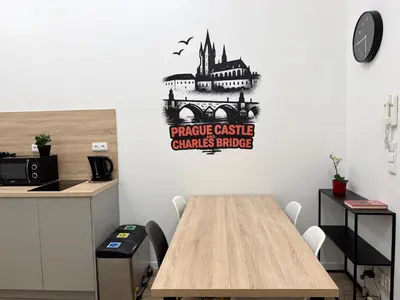 a table in an office with a castle criminaljustice badge on the wall at MiSTO 16 in Prague