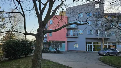 a group of buildings with a car parked in front at Grand Prague Residence in Prague