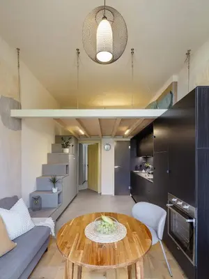 a living room with a table and a couch at Cozy apartment in Vinohrady café & culture zone in Prague