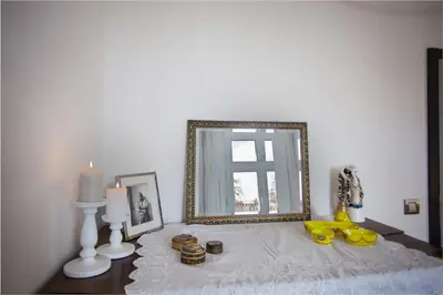 a mirror sitting on top of a table in a room at Central river view in Prague