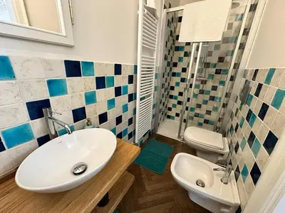 a bathroom with a sink and a toilet at Luxury flat in Wenceslas Square in Prague