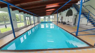 an empty swimming pool in a building at Wellness resort Kytra in Slavětín