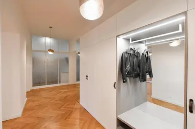 a room with a door with a jacket in it at Elegant Garden Apartment near Main Station in Prague