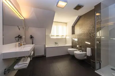 a bathroom with a sink and a toilet and a shower at Residence Mysterius Old Town in Prague