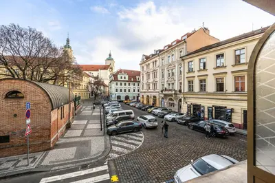 a city street with cars parked in a parking lot at Residence Mysterius Old Town in Prague