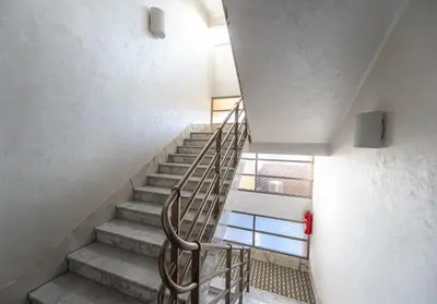 a staircase with a metal railing in a building at Residence Mysterius Old Town in Prague