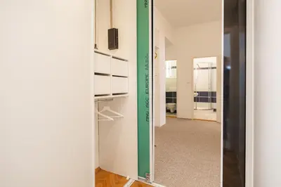 a room with a green door and a hallway at Hubert Family Rezidence Prague in Prague