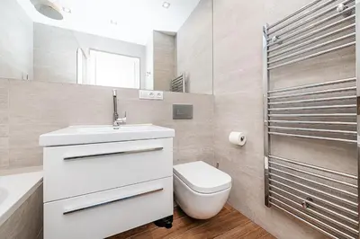 a bathroom with a toilet and a sink and a shower at Stunning Modern 2bedroom with Iconic View in Prague
