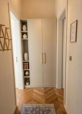 a living room with a cabinet and a rug at Beautiful apartment with terrace in center of Prague in Prague