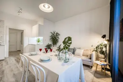 a living room with a table and a couch at 100m2, 3 room, Old Town Prague Flat in Golčŭv Jeníkov