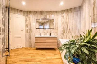 a bathroom with a sink and a mirror and a plant at 100m2, 3 room, Old Town Prague Flat in Golčŭv Jeníkov
