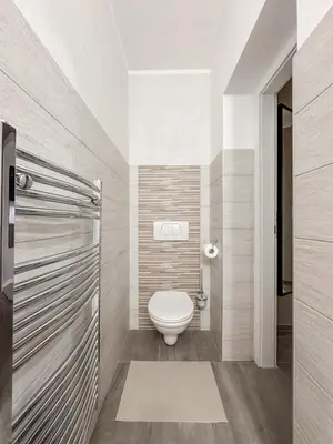 a bathroom with a toilet in a room at Design apartment in Prague 6 in Prague