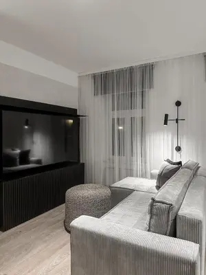 a hotel room with two beds and a couch at Design apartment in Prague 6 in Prague