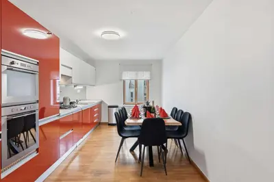 a dining room with a table and chairs in a kitchen at Nature Diamond Suite in Prague