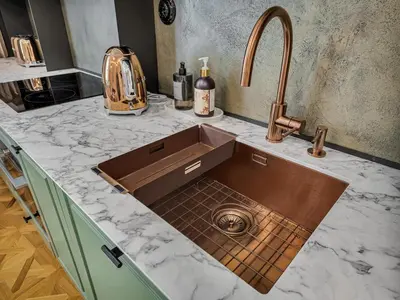 a kitchen with a sink and a counter top at Romantic Apartman by Prague Castle in Prague