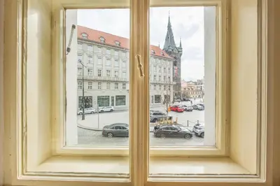 an open window with a view of a city street at 3BR Apartment in Old Town - Self Check-in - Prague 1 - Sleep up to 8 in Prague