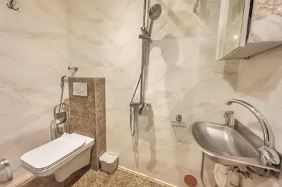 a bathroom with a shower and a toilet and a sink at 3BR Apartment in Old Town - Self Check-in - Prague 1 - Sleep up to 8 in Prague