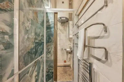 a bathroom with a shower and a sink at 3BR Apartment in Old Town - Self Check-in - Prague 1 - Sleep up to 8 in Prague