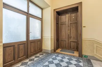 an empty room with a door and a tile floor at 3BR Apartment in Old Town - Self Check-in - Prague 1 - Sleep up to 8 in Prague