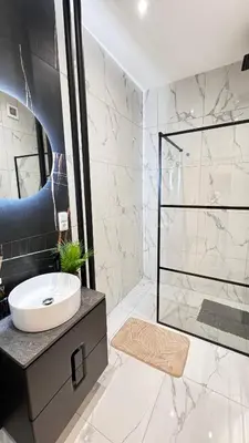 a bathroom with a sink and a shower at Florenc Grant Apartments in Prague