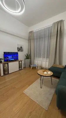a living room with a couch and a table at Vinohrady 105 - Prestige in Prague