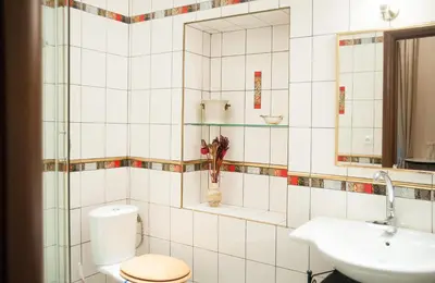 a bathroom with a toilet and a sink at Just For Two Ruterra Studio in Prague