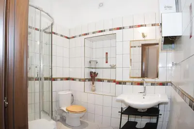 a bathroom with a toilet and a sink at Just For Two Ruterra Studio in Prague