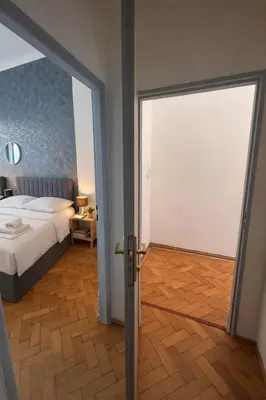 a bedroom with a bed and a sliding glass door at Lidická 31 Apartment Prague ,2 Bedrooms ,8 Guests ,Near Center in Prague