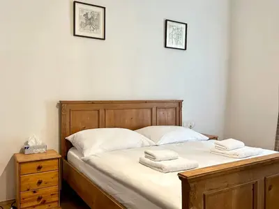 a bedroom with a bed with two towels on it at Spacious 2BR in Historical Vinohrady in Prague