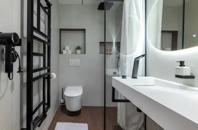 a bathroom with a sink and a toilet at Prague Castle View by Charles Bridge in Prague