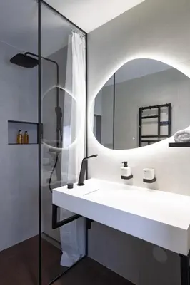 a bathroom with a sink and a mirror at Prague Castle View by Charles Bridge in Prague