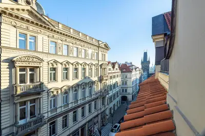 a view of a city street with buildings at Prague Castle View by Charles Bridge in Prague