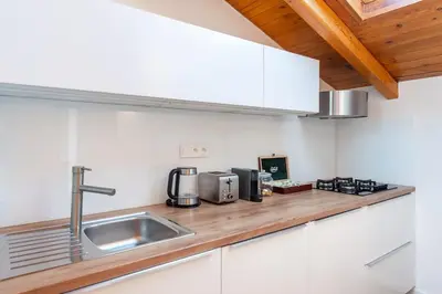 a kitchen with a sink and a counter top at Old Prague View Rooftop Studio with AC in Prague