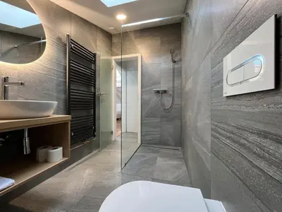 a bathroom with a sink and a toilet and a shower at Old Prague View Rooftop Studio with AC in Prague