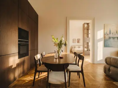 a dining room with a table and chairs at TurnKey I Grand 5-Bedroom Apartment with Balcony near Wenceslas Square in Prague