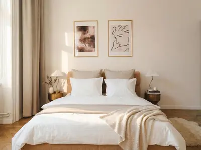 a bedroom with a large bed with white sheets and pillows at TurnKey I Grand 5-Bedroom Apartment with Balcony near Wenceslas Square in Prague