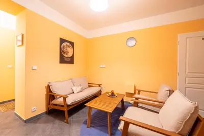 a living room with a couch and a table at Luna Female Hostel in Prague