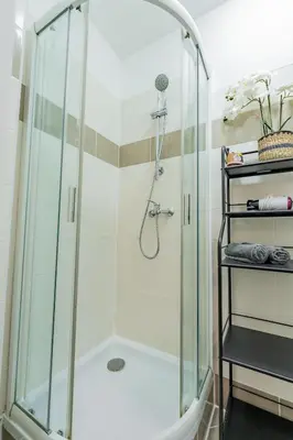 a shower with a glass enclosure in a bathroom at Luna Female Hostel in Prague