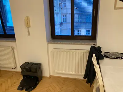 a room with a window and a computer on a table at Wenceslas Square Center in Prague