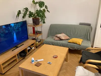 a living room with a couch and a television at Wenceslas Square Center in Prague