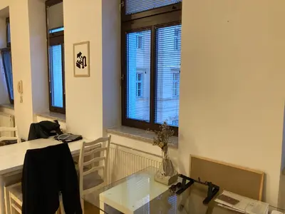 a dining room with a glass table and a window at Wenceslas Square Center in Prague