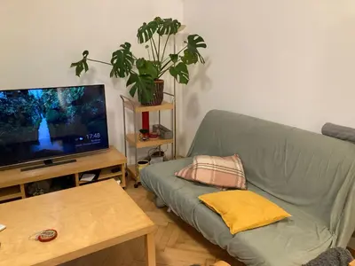 a living room with a couch and a flat screen tv at Wenceslas Square Center in Prague
