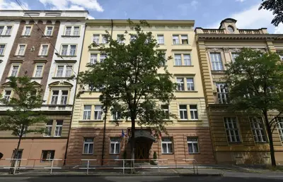 a large building with a tree in front of it at Garden Studio in Prague