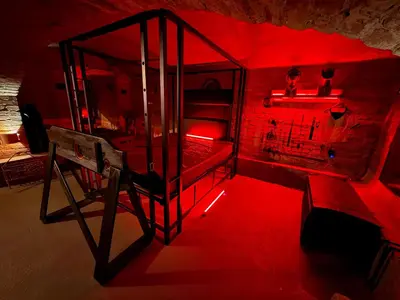 a red room with a bunk bed with a red light at Playroom Prague Vinohrady in Prague