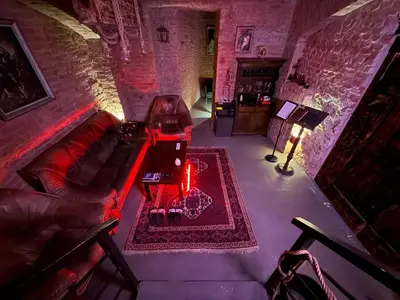 an overhead view of a living room with a couch and a table at Playroom Prague Vinohrady in Prague